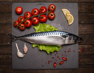 Top View of Fresh Raw Whole Fish Mackerel on Slate Cutting Board