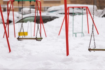 Closeup image of outdoors playground covered by deep snow