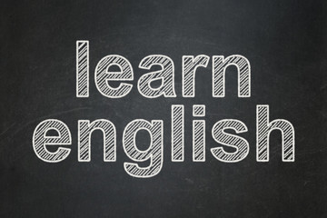 Fototapeta na wymiar Studying concept: Learn English on chalkboard background
