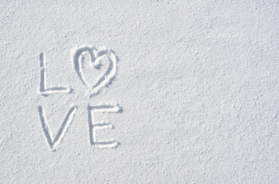 Text LOVE and heart hand written on snow background. Horizontal valentines postcard template. Space for copy, lettering.
