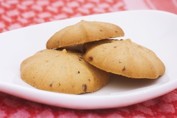 Cookies in cup on the red apron