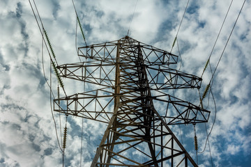 High-voltage line with electric pylons on the background of  clo