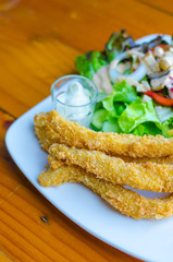 Fried fish with salad.