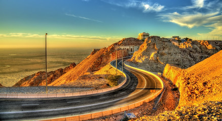 Road on top of Jabel Hafeet mountain in UAE - obrazy, fototapety, plakaty