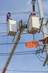 Electrical repairs on a power pole