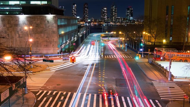 USA. New York City. Transport interchange at the corner of 1st Avenue and E 42 street. Night. Time lapse 4K