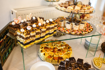stylish luxury tables with sweets for the celebration for a wedd
