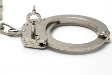 Close-up of key in handcuffs