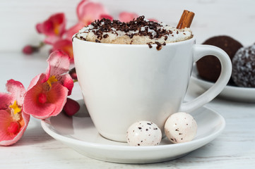 Latte with cake and orchid on the table