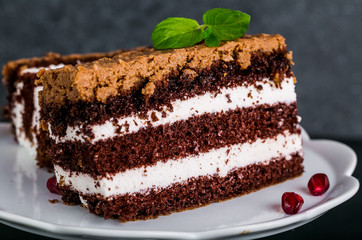 Chocolate cake stuffed with whipped cream and crunchy topping