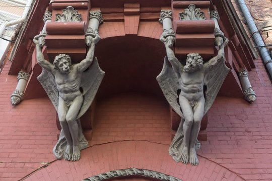 Sculptures demon with wings on wall of house in Kiev. Ukraine