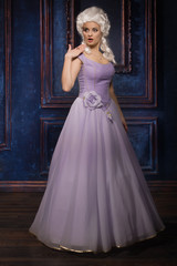 Fototapeta premium Woman in historic baroque style dress and white wig
