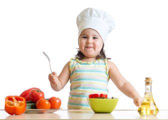 child girl chef cook with fresh vegetables, healthy eating concept