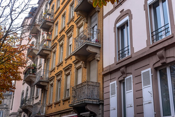 Fototapeta premium Facade of old European building with balcony autumn