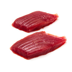 Raw Yellowfin tuna fish steaks isolated on a white background