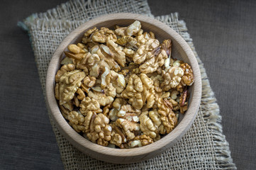 walnuts in the wooden bowl on table
