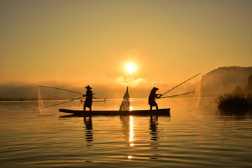 Fototapeta premium Fishermen in action when fishing in the mekong river , Thailand