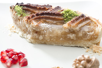 Apple pie close up over white background.