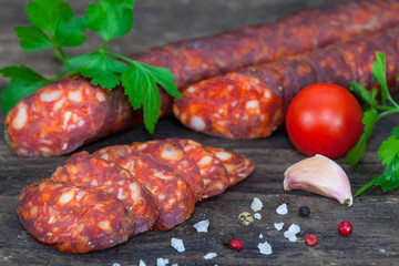 Smoked sausage with tomato, pepper, garlic and herbs