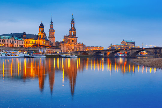 Dresden Cathedral of the Holy Trinity or Hofkirche, Bruehl's Terrace or The Balcony of Europe, Semperoper and Augustus Bridge with reflections in the river Elbe at night in Dresden, Saxony, Germany