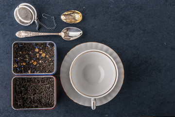 Obraz na płótnie Canvas Tea set on the dark stone table 