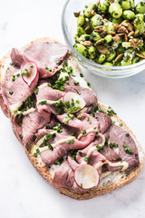 Beef sandwich and salad