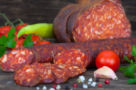 Delicious and tasty meat dishes. Smoked sausage and salami. Italian appetizers.