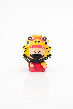 statuette of Chinese old god toy isolated on white background 