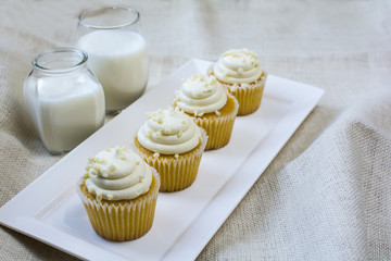 Four French Vanilla Cupcakes and milk glass dessert