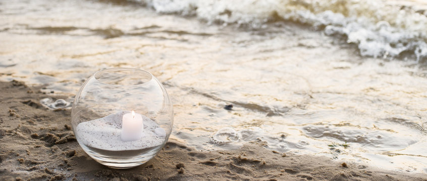 Fototapeta One candle at the sea