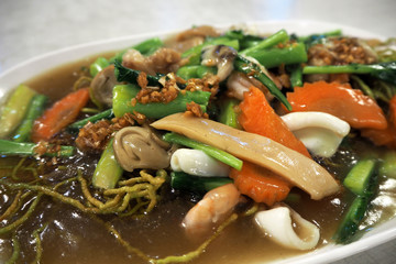 Wide rice noodles in gravy