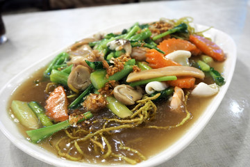 Wide rice noodles in gravy