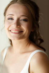 happy cute bride is posing and smiling