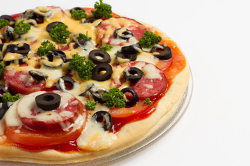 Pizza with tomatoes, salami, cheese and olives