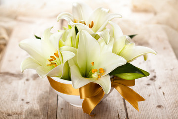 White lilies on table.