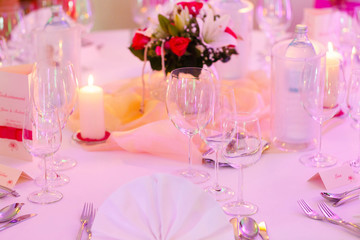 romantic decoreted table with candles and flowersfor celebration