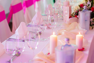 romantic decoreted table with candles and flowersfor celebration