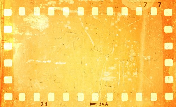 Grunge orange film strip frame.