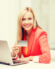 businesswoman with laptop using credit card