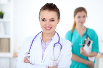 Fototapeta premium Portrait of young female doctor in a hospital