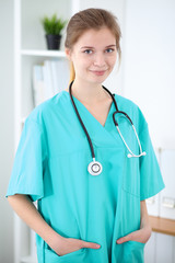 Portrait of young female  doctor in a hospital