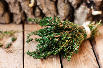fresh thyme on a wooden background