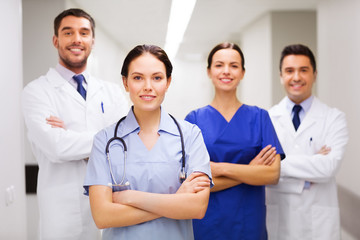 happy group of medics or doctors at hospital