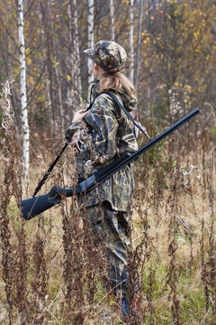 Woman hunter in camouflage