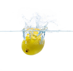 Fototapeta na wymiar lemon falling or dipping in water with splash