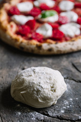 A Pizza Margharita with tomato sauce, mozzarella and basil