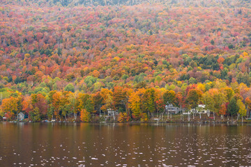 Beautiful autumn foliage and cabins in Elmore state park, Vermont