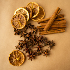 Anise, cinnamon with lemon on kraft paper