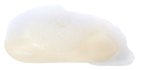 Wet soap with foam close up isolated.