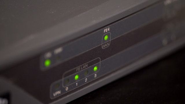 Network router close view with blinking port leds and sharp colors